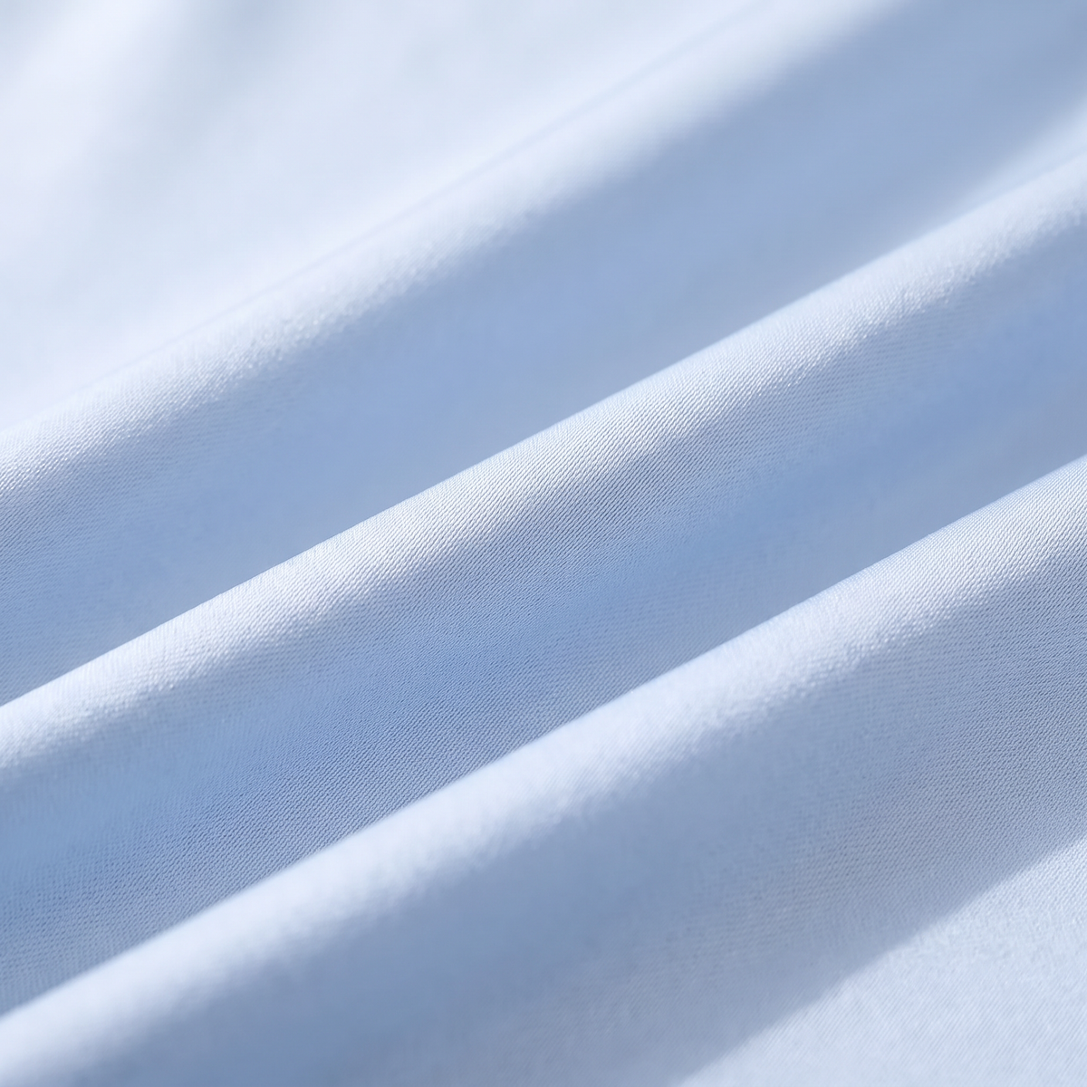 Close-up of Covelle ice-silk fabric weave with cool sheen, light blue