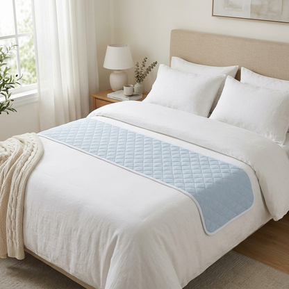 Covelle washable bed pad on a made bed