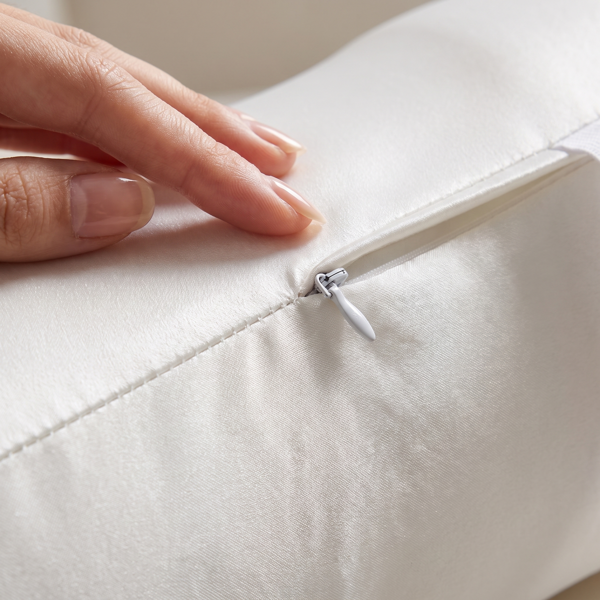 Close-up of the Covelle knee pillow ice-silk cover and zipper